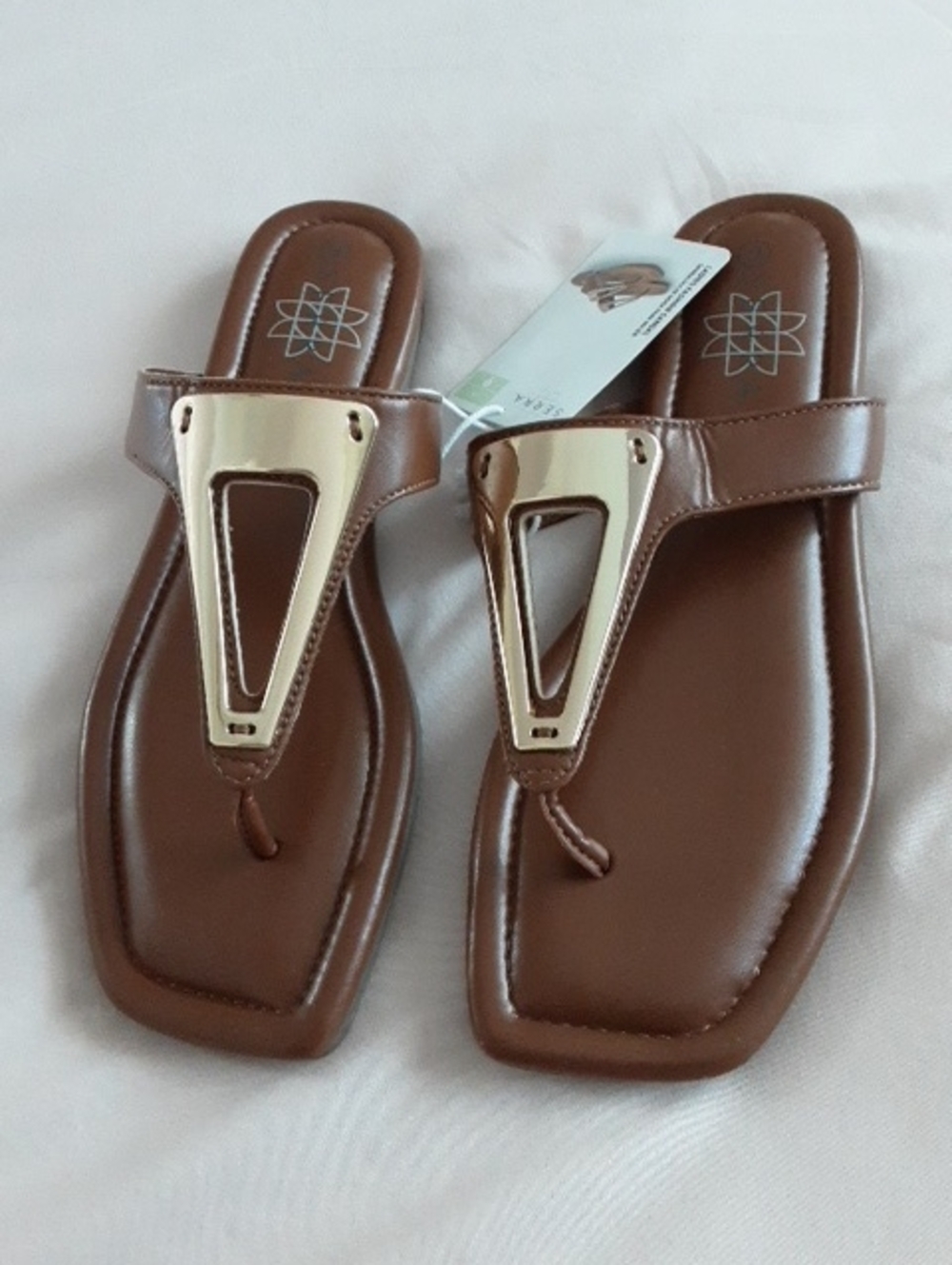 Serra Brown Thong Sandals with Gold Accent Plate.